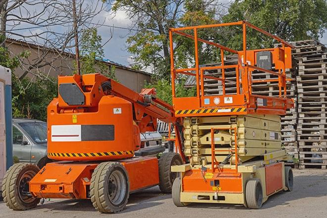 warehouse worker operating a forklift in a shipping yard in Cascade